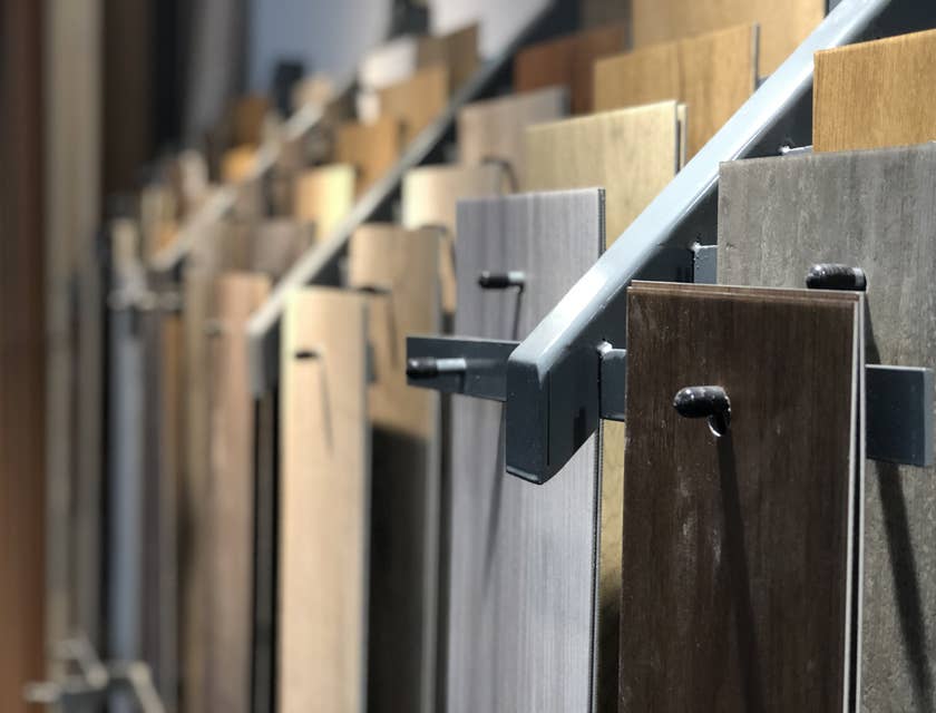 Samples of laminate flooring hanging on a display rack.