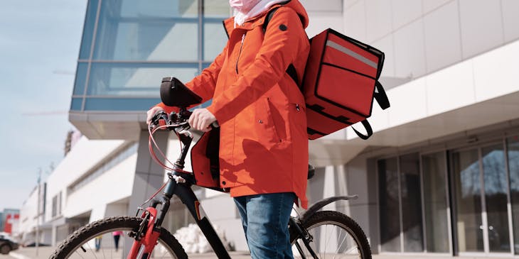 Food delivery service person with a bicycle.