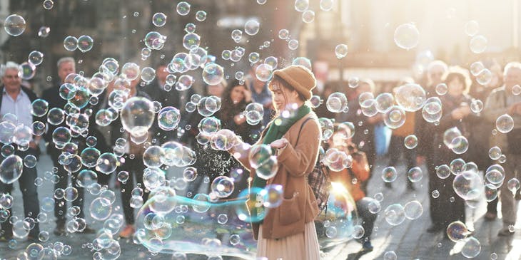 Woman having fun blowing bubbles.