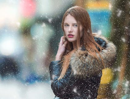 A female model wearing fur clothing.