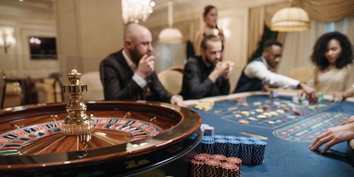 Gamblers playing roulette at a casino.
