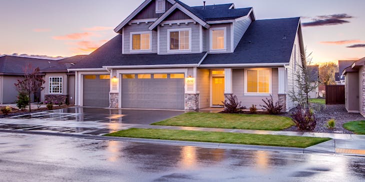 The front picture of a house with garage.