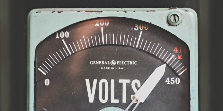 A voltmeter reading voltage from a generator.