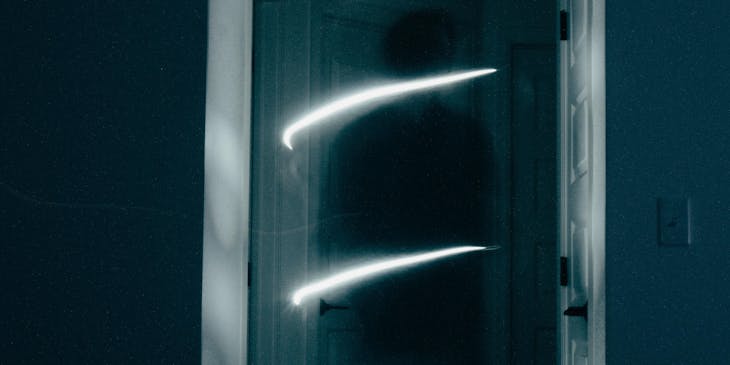 The image of a ghost in a doorway caught by a ghost hunter.