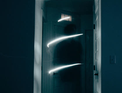 The image of a ghost in a doorway caught by a ghost hunter.