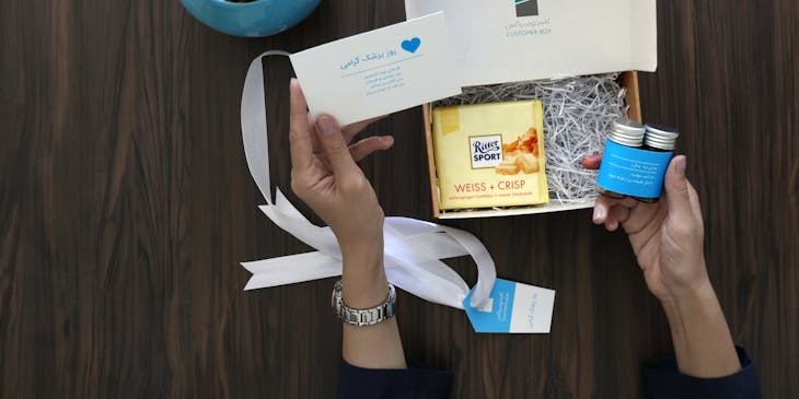 Person opening a gift box