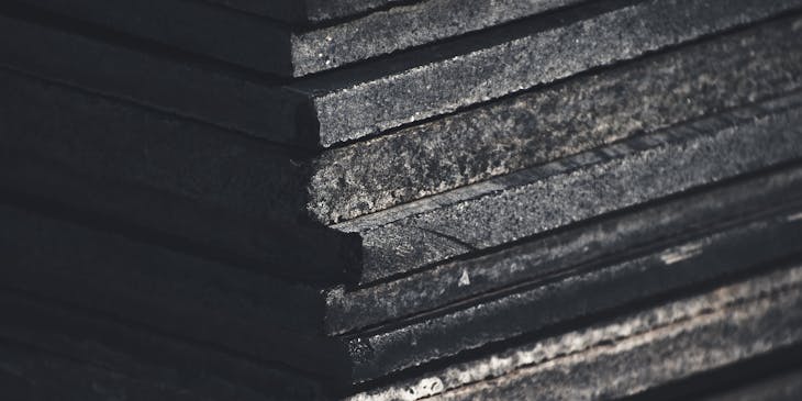 Stack of dark granite slabs at granite business