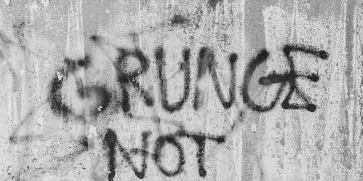 A grungy message scrawled on a wall.