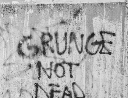 A grungy message scrawled on a wall.