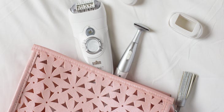 White hair removal tools spilling out of pink bag.