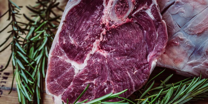 Halal meat on a wooden board.
