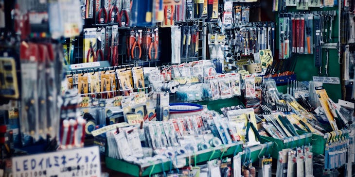 Various tools in packaging hanging in a hardware store