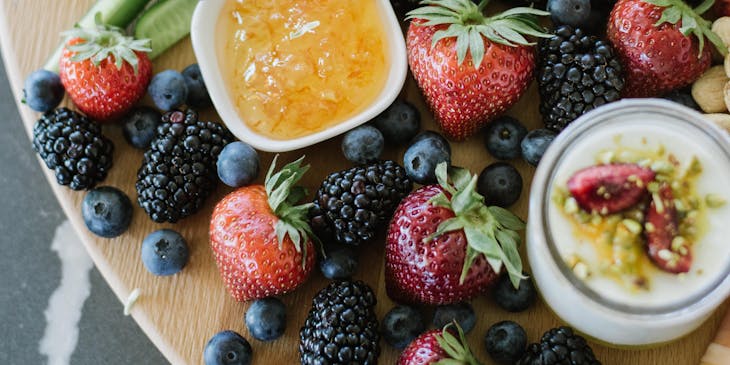 An assortment of vegetables and berries on sale at a healthy food business.