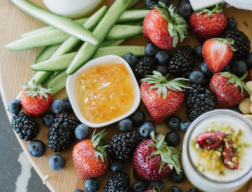 An assortment of vegetables and berries on sale at a healthy food business.