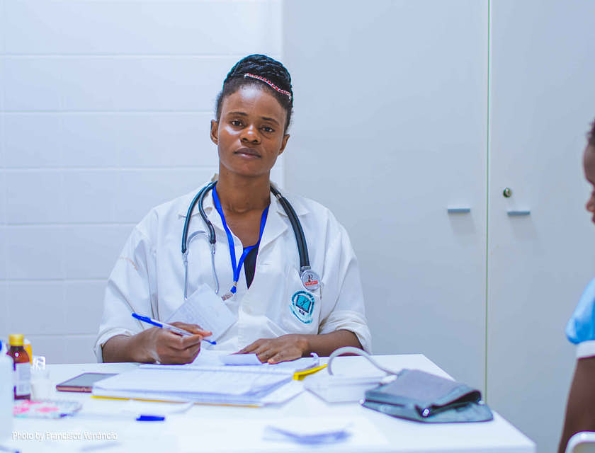A hospitalist sitting at a desk.