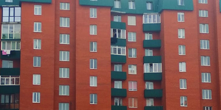 Red and green apartment building.