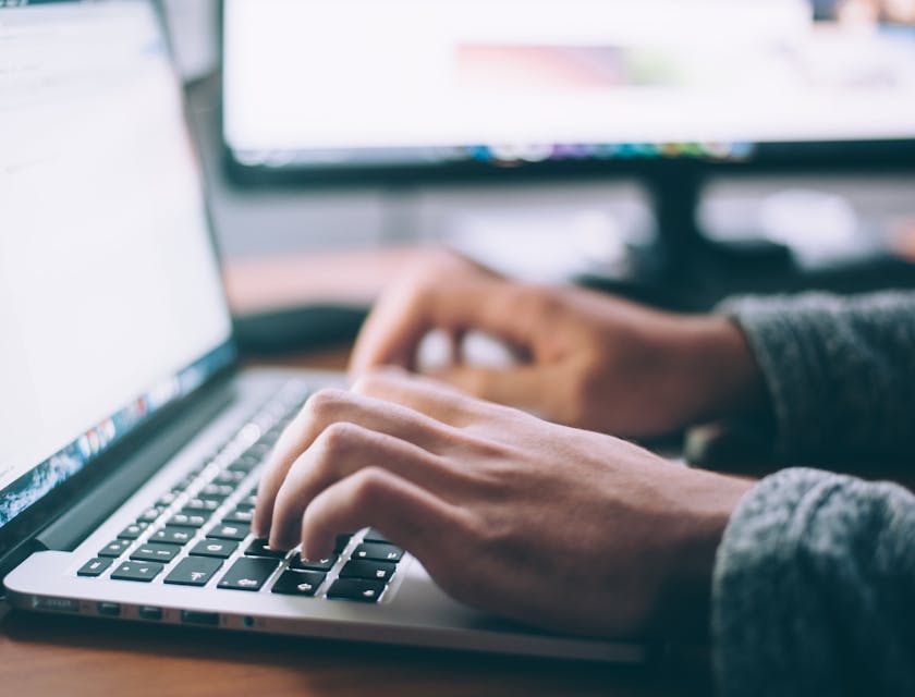 person using a laptop to check if a business name is available