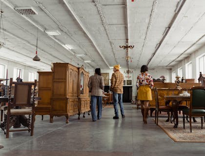 People walking through a furniture store looking at the products.