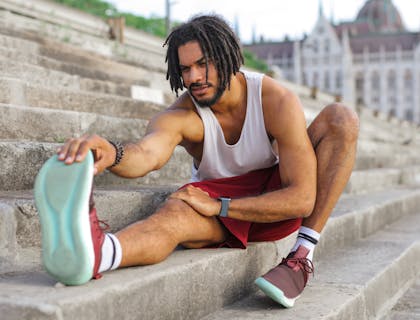 man stretching on steps