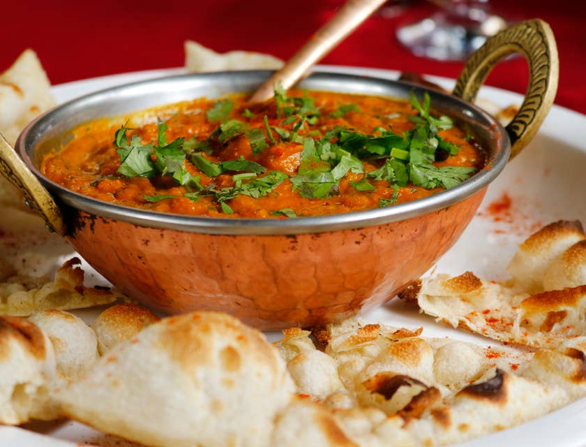 Dish with naan bread at an Indian restaurant.