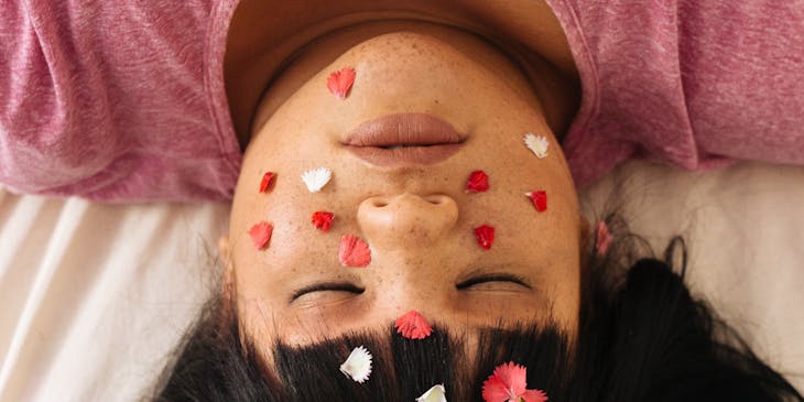 Woman in dreamlike state under hypnosis or hypnotherapy.