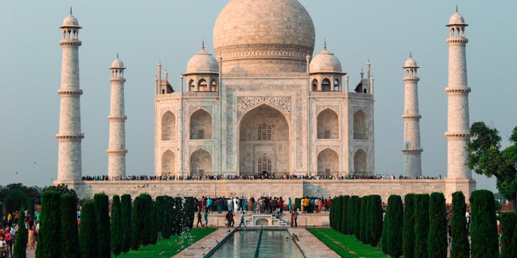 Tourists walking outside the Taj Mahal in India.