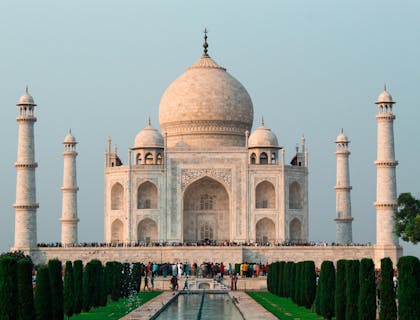 Tourists walking outside the Taj Mahal in India.