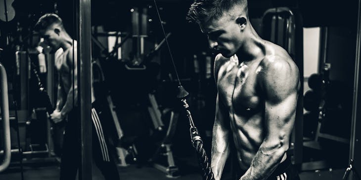 A man doing interval training in a gym.