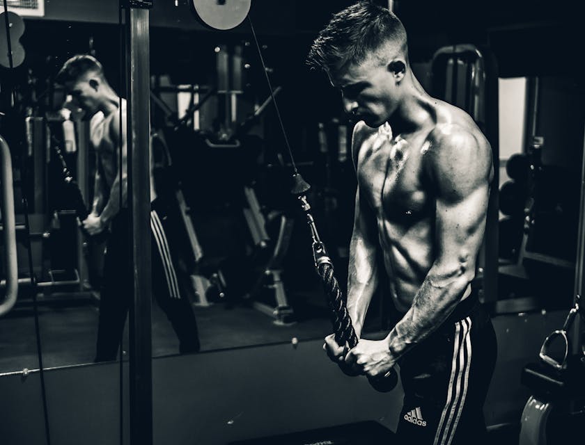 A man doing interval training in a gym.