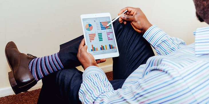 Man looking at investment portfolio.