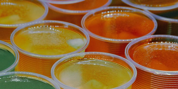 An assortment of jelly cups in varying colors.