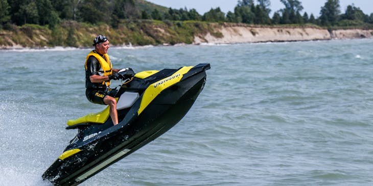 Man on yellow and black jet ski.