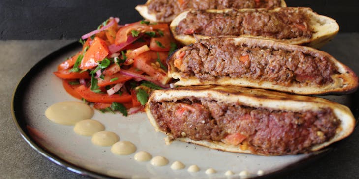 Meat dish on a plate in a kosher restaurant.