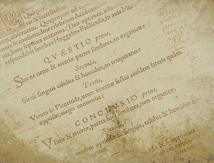 Page from an old book with Latin writing on it.