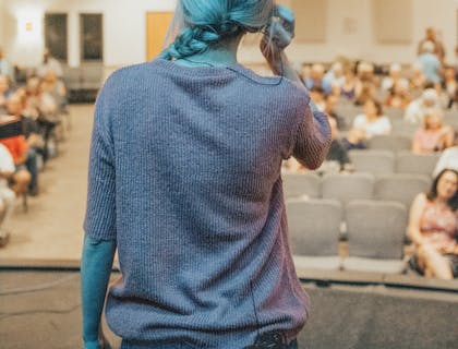 A life coach talking to an audience.