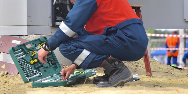 Close-up of a maintenance man and his tool box.