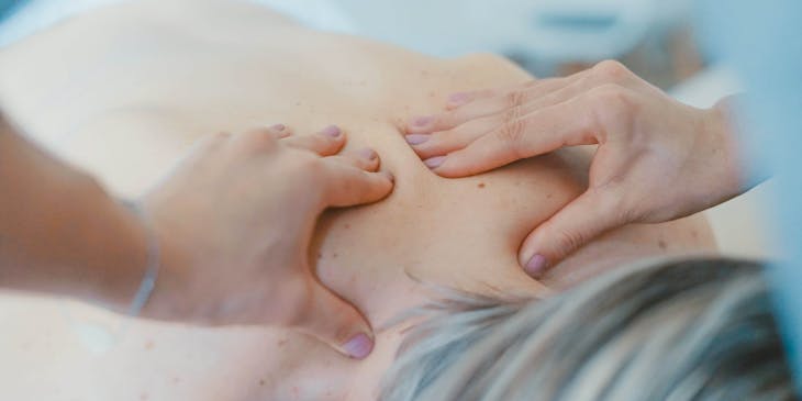 A customer getting a back massage.