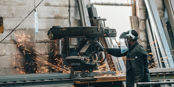 A person working at a metal fabrication business.