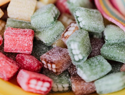 Pink and green Mexican candies of various shapes and sizes.
