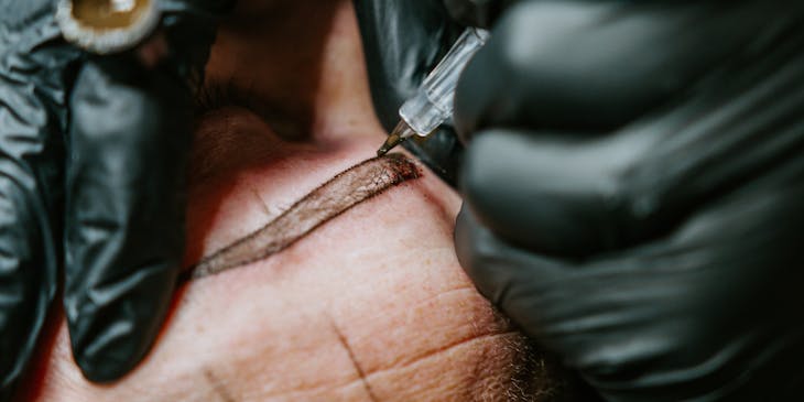 Person undergoing a microblading treatment.