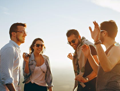 A group of millennial people laughing and having fun.