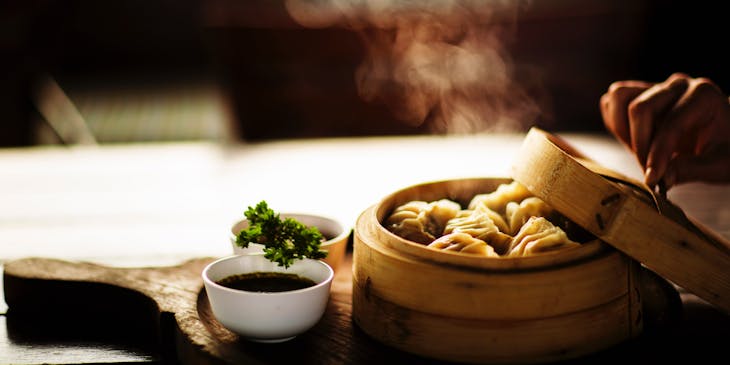 Dumplings in a bamboo steamer at a Mongolian restaurant