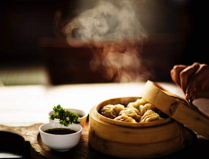 Dumplings in a bamboo steamer at a Mongolian restaurant