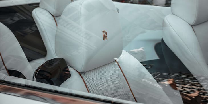 Monogrammed white and red car interior.