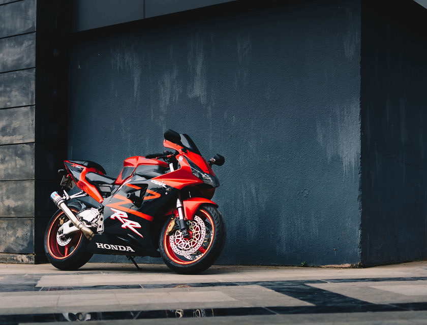 A new motorcycle bought from a dealer in the sunlight.