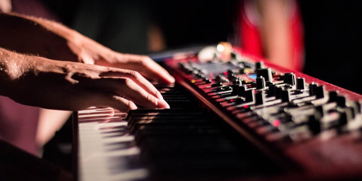 A man playing an electronic keyboard.