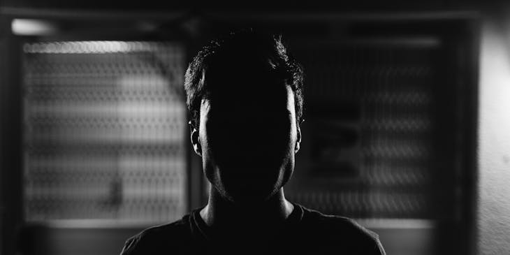 man's face in the dark
