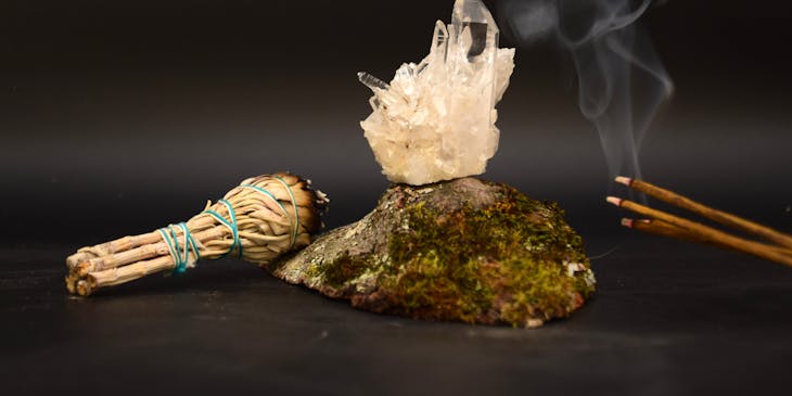 Incense, burning sage, and crystals.
