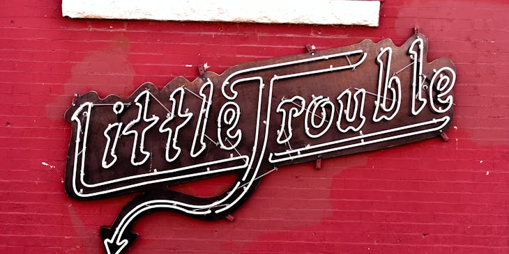 "Little Trouble" neon business sign.