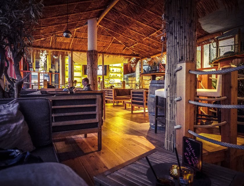 A wide shot of patrons in a nautical bar.